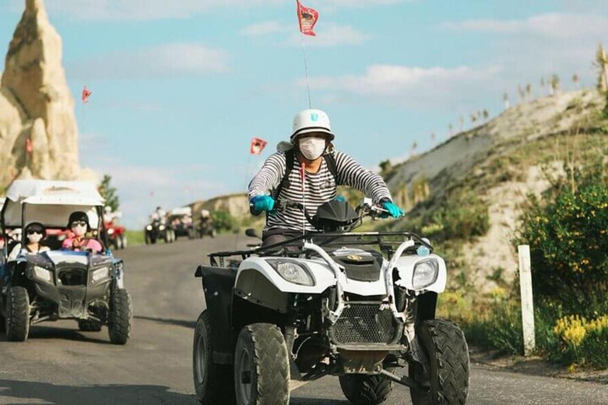a man riding a four wheeler with a side car