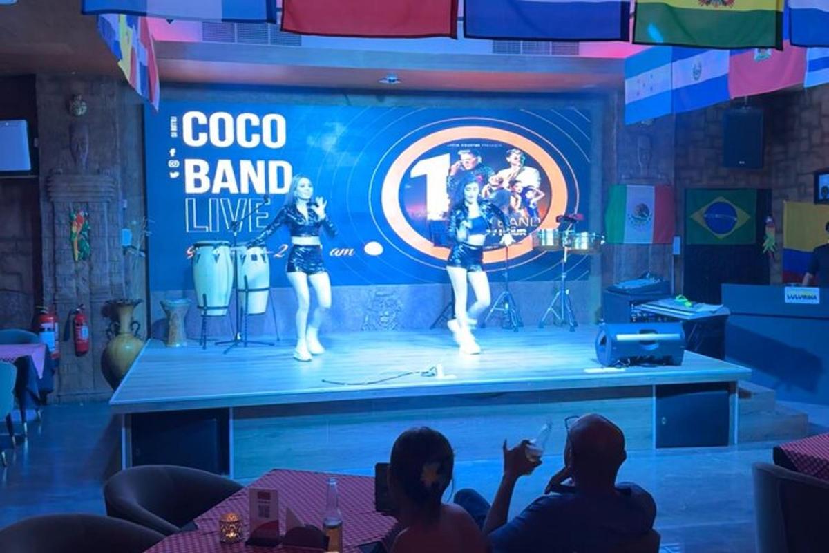a group of people watching a concert on a stage
