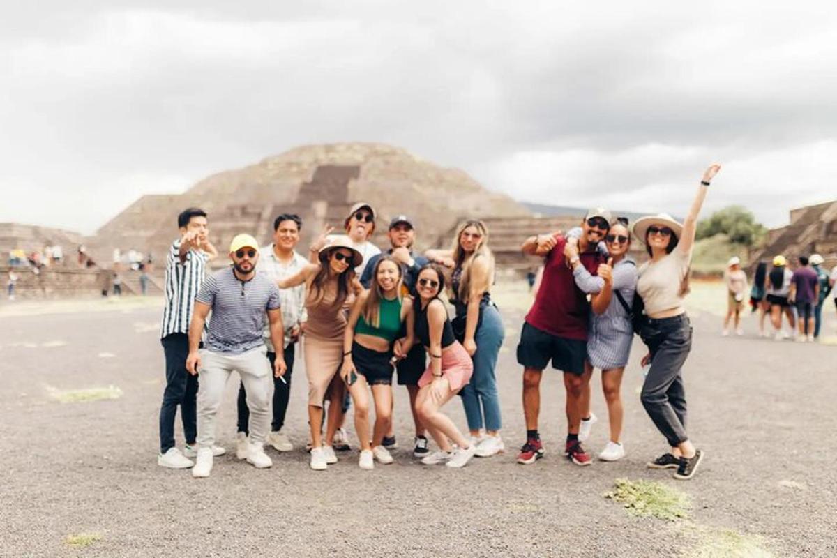 a group of people posing in front of the pyramid