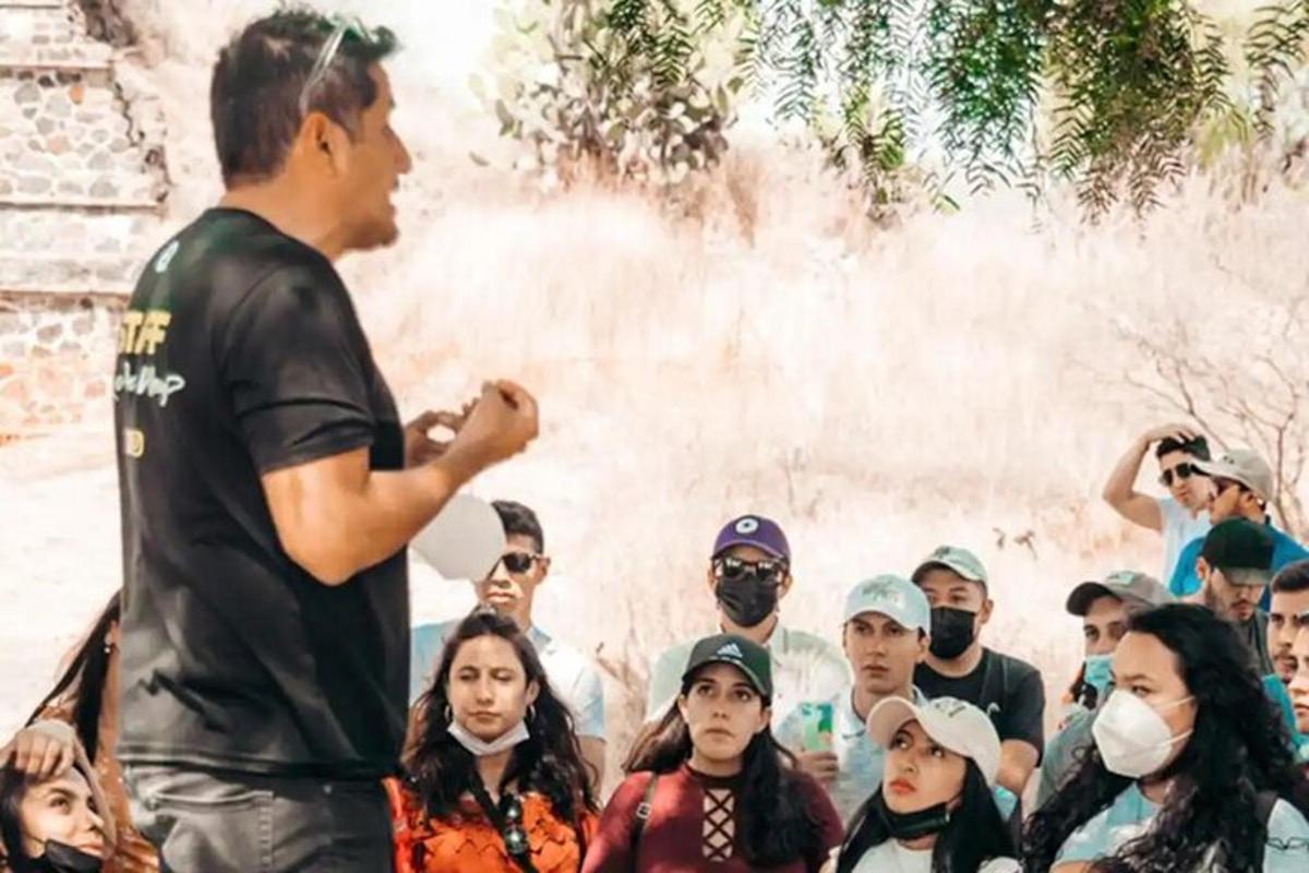 a man standing in front of a crowd of people