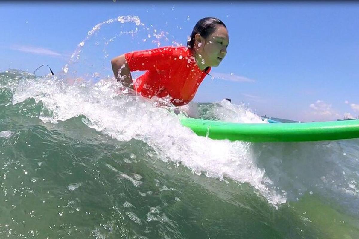 a person riding a wave on a surfboard in the ocean