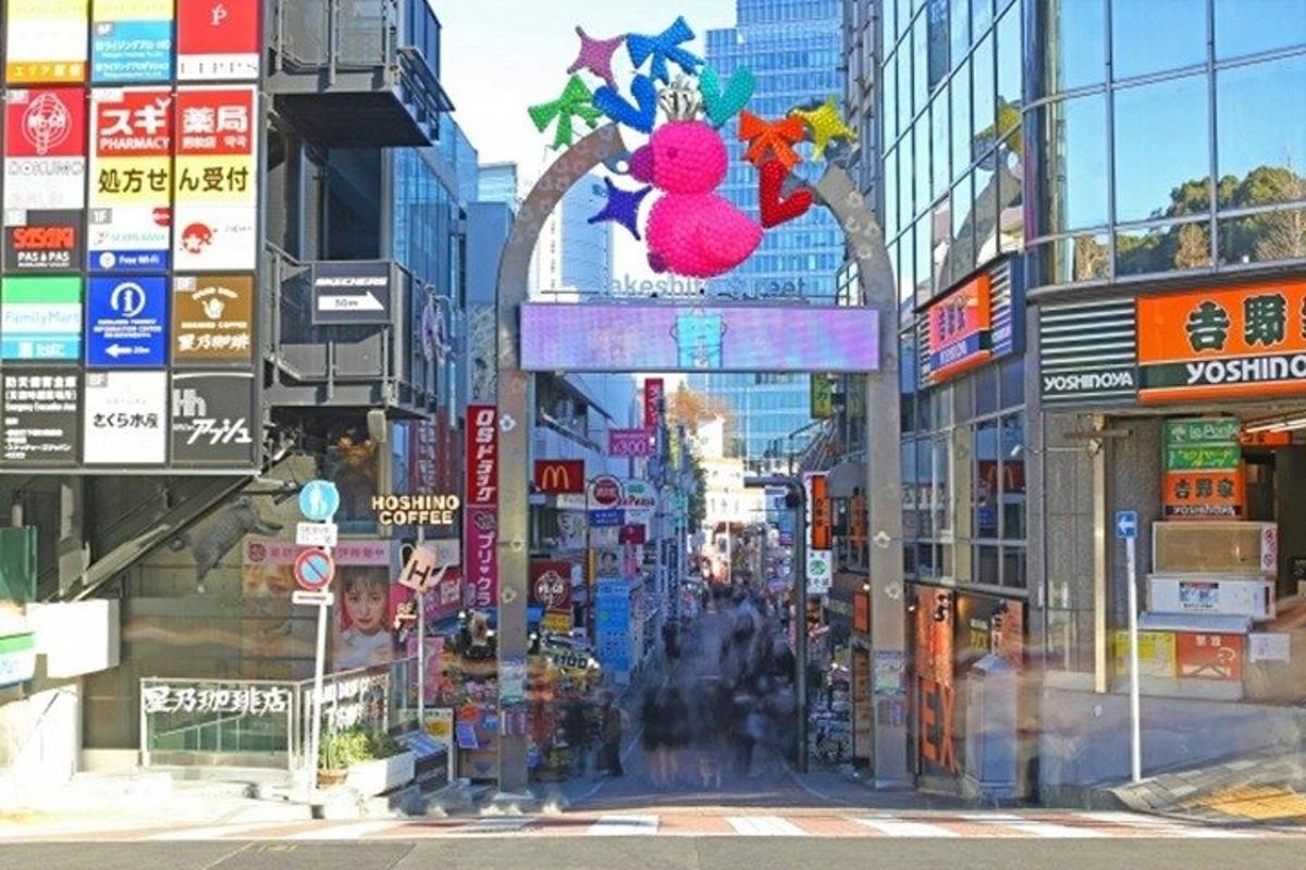 a busy city street with many signs and buildings