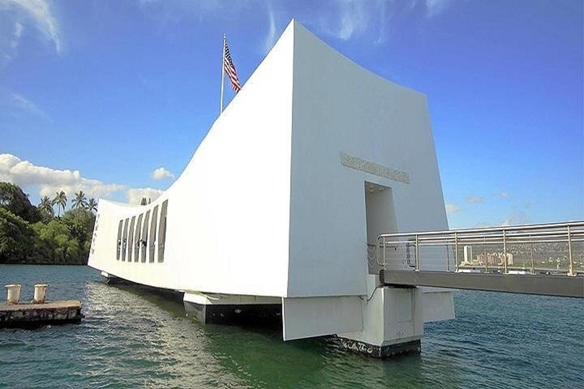 a large white building sitting in the water