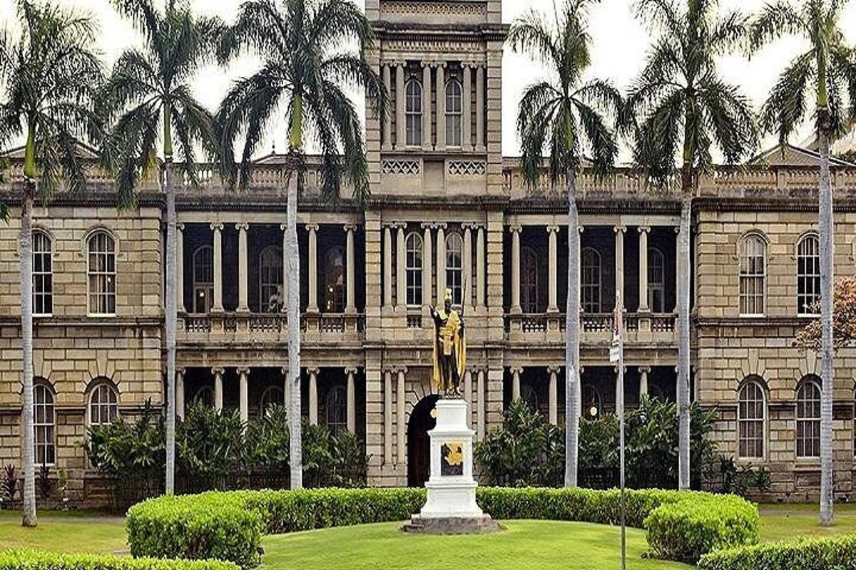a large building with a statue in front of it