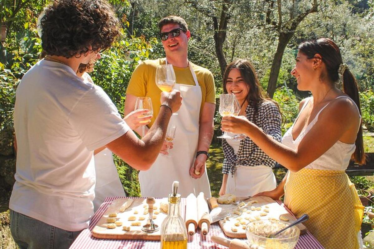 a group of people standing around a table with wine glasses