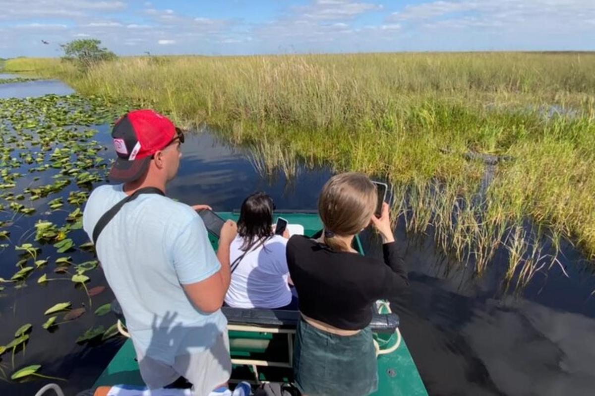 a group of people on a boat in the water