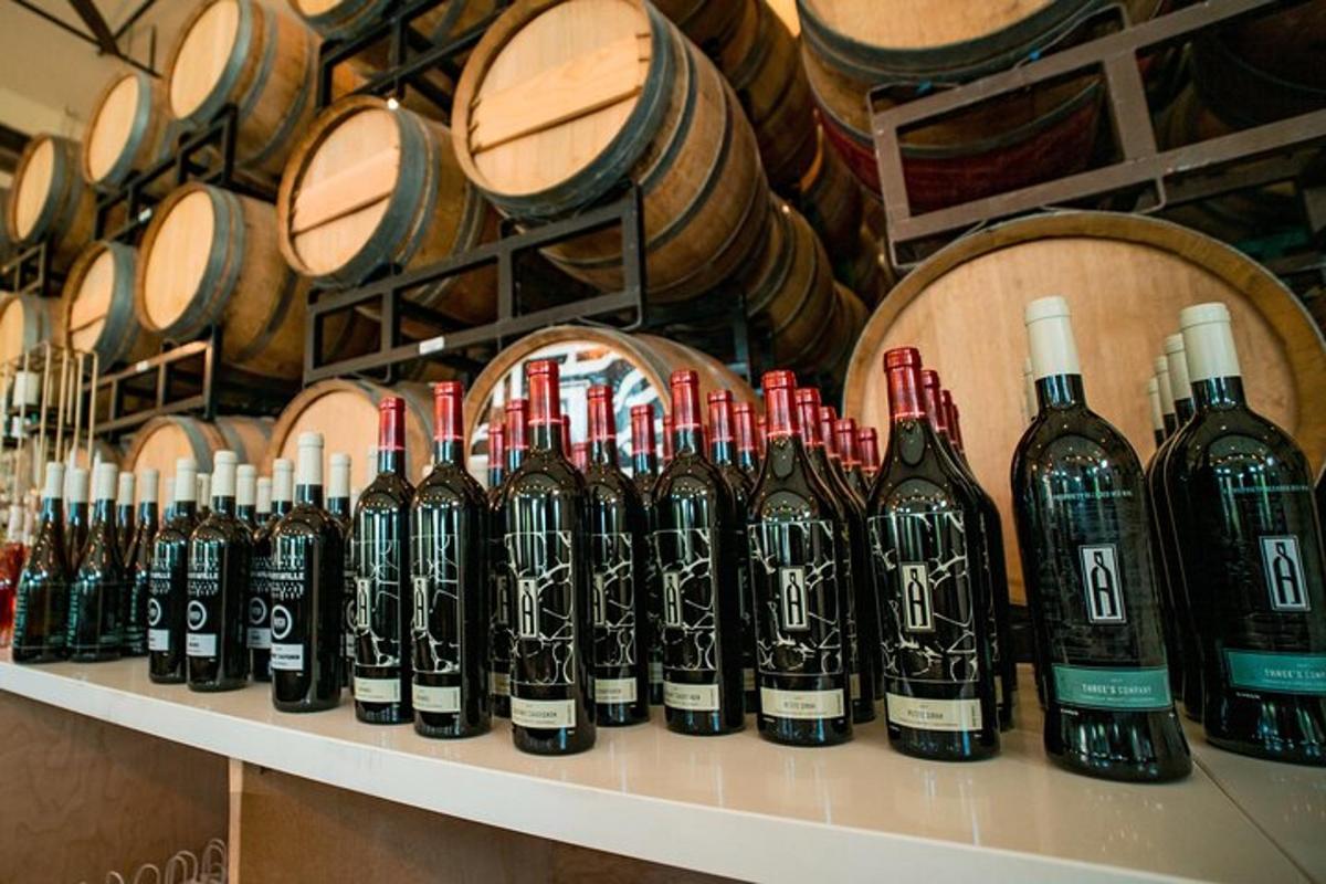 a bunch of bottles of wine sitting on a shelf