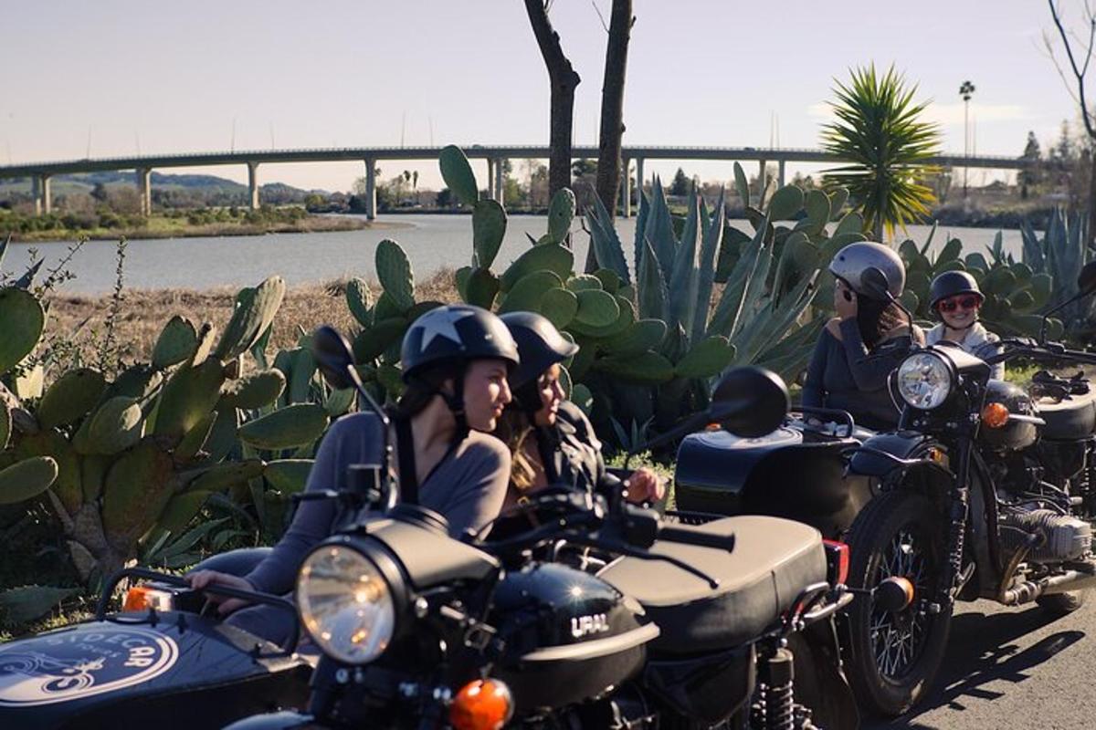 a group of people riding motorcycles down a road