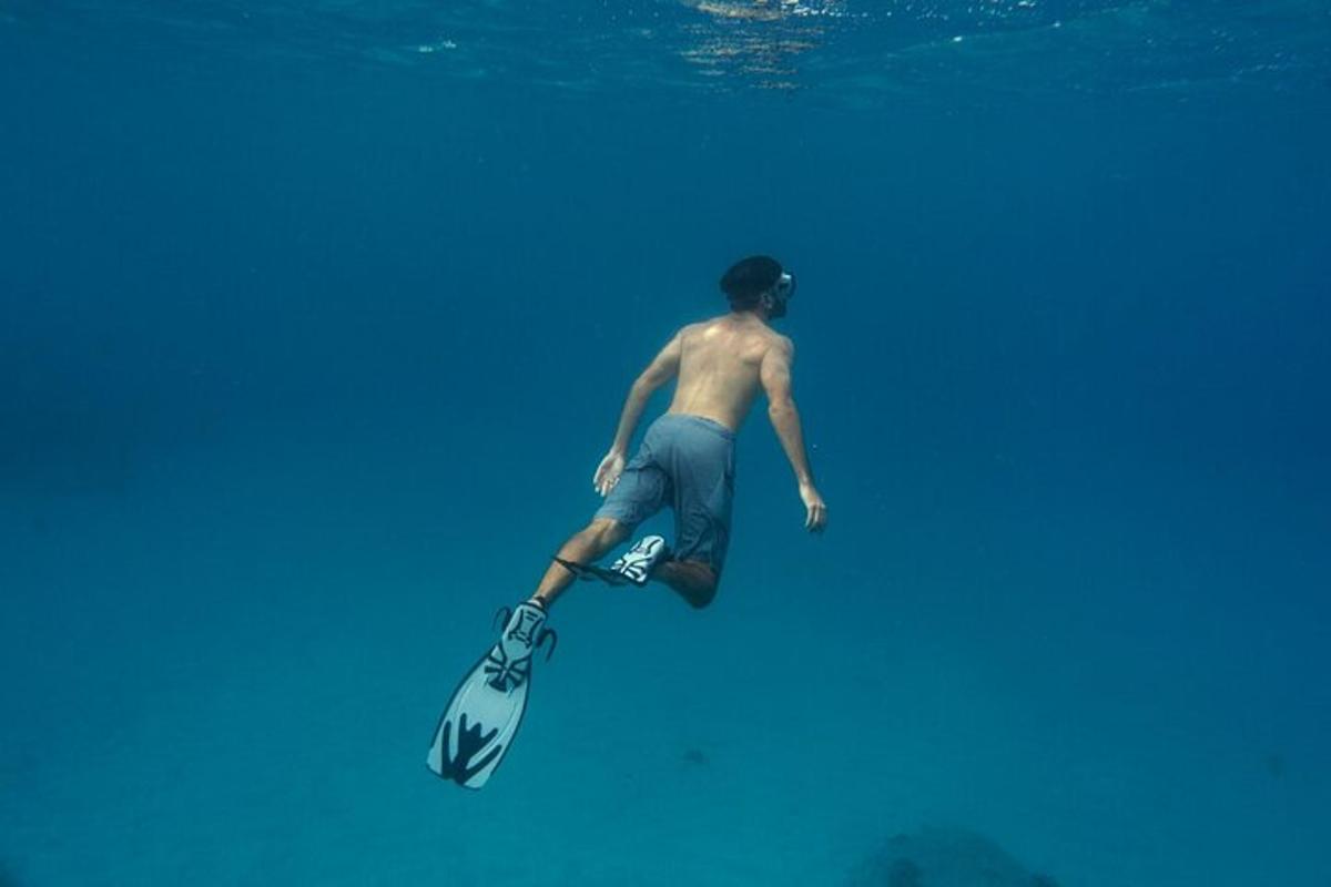 a man riding a paddle board in the water