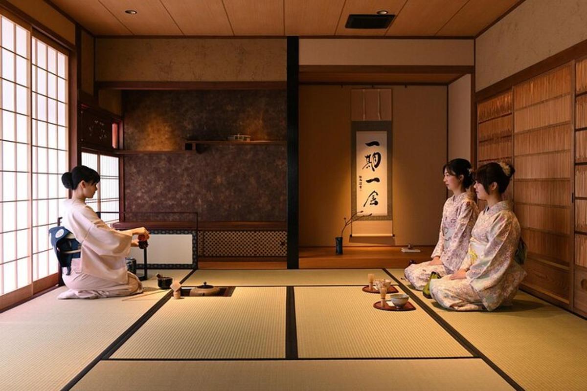 three women in kimonos sitting on the floor of a room