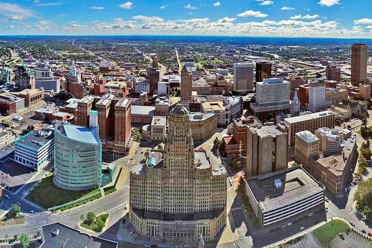 an aerial view of a city with tall buildings