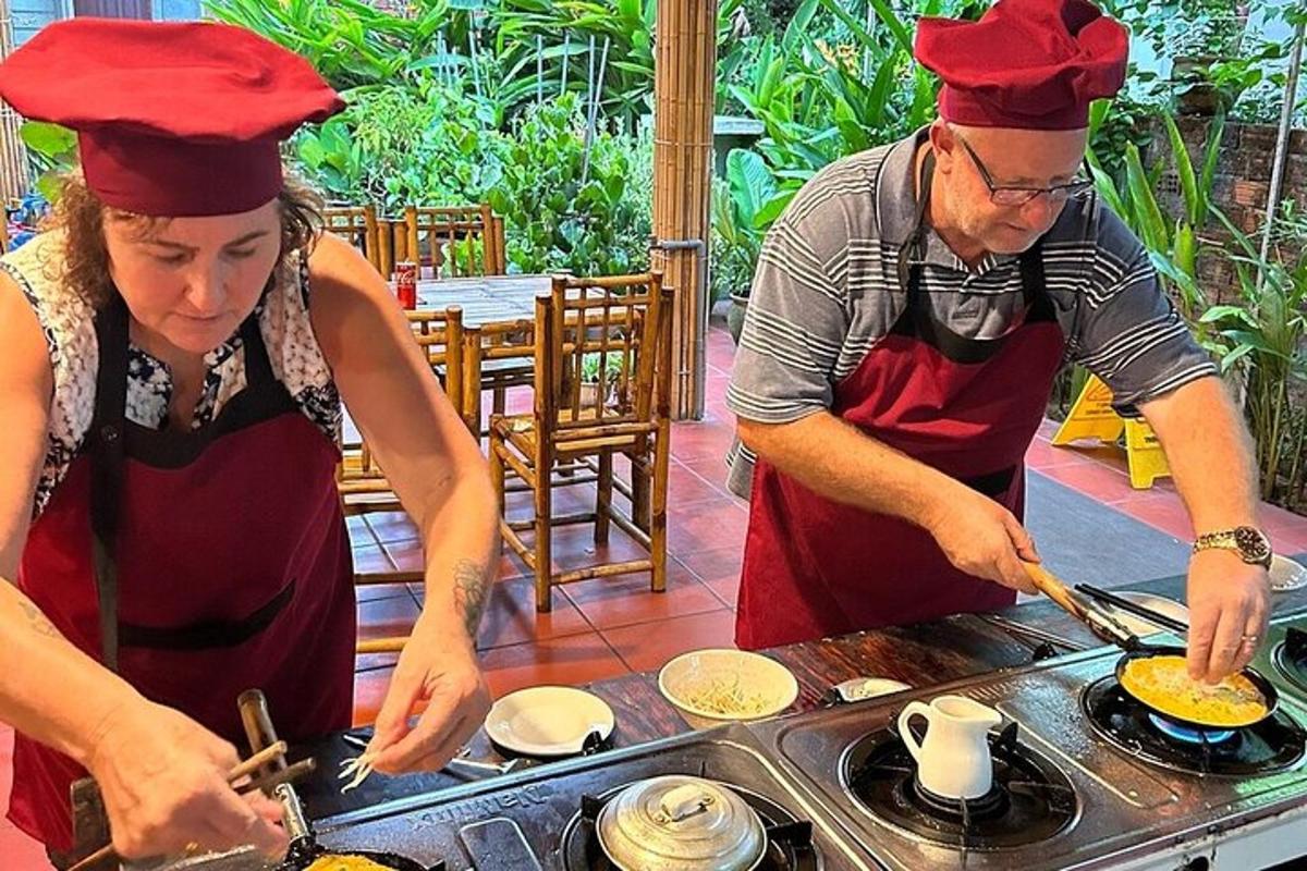 a man and a woman preparing food on a grill