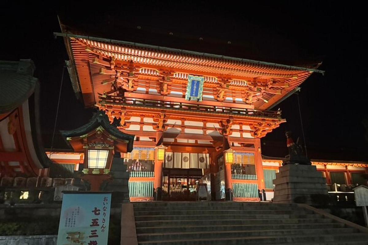 a large building with stairs in front of it at night