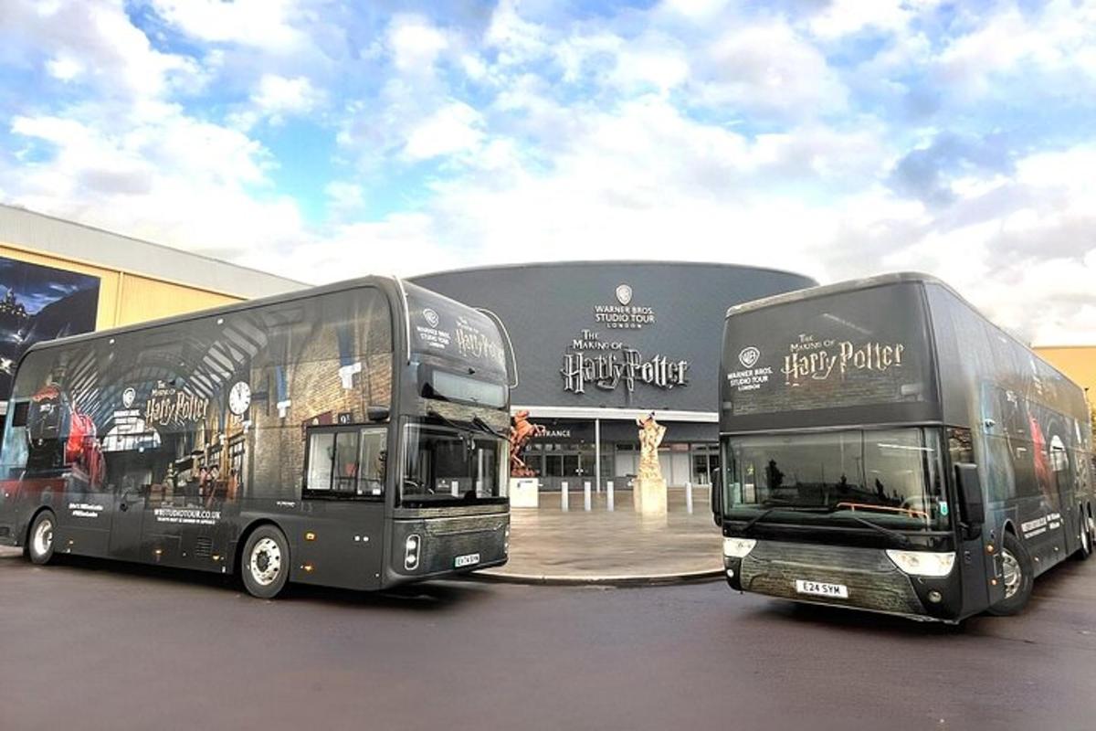 two double decker buses parked in front of a building