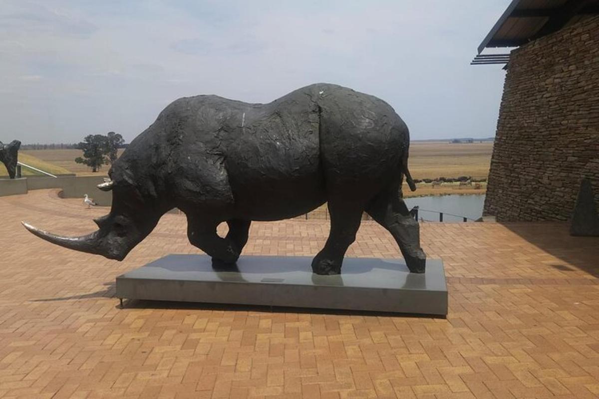 a statue of an elephant walking on a platform