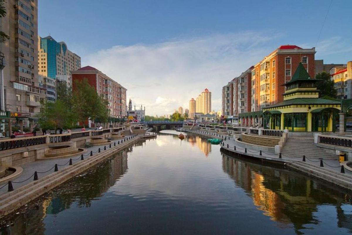 a river in the middle of a city with buildings