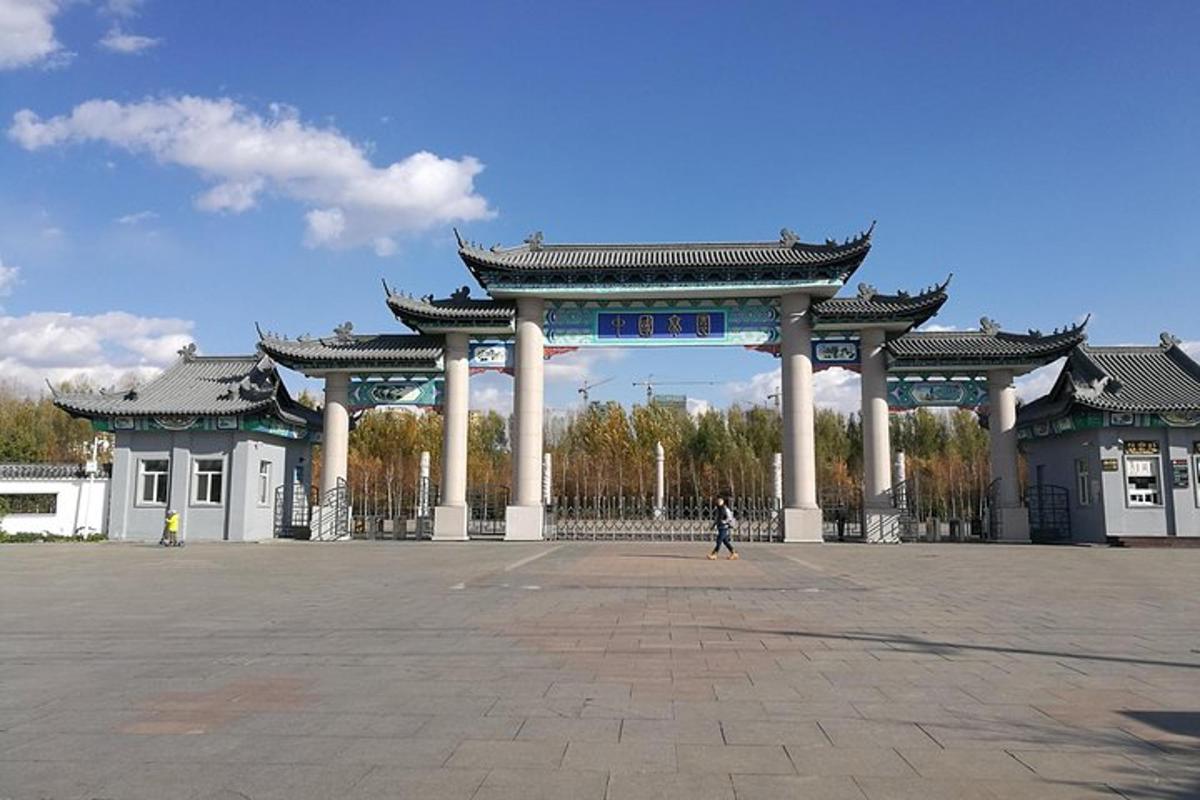a person walking in front of a large building