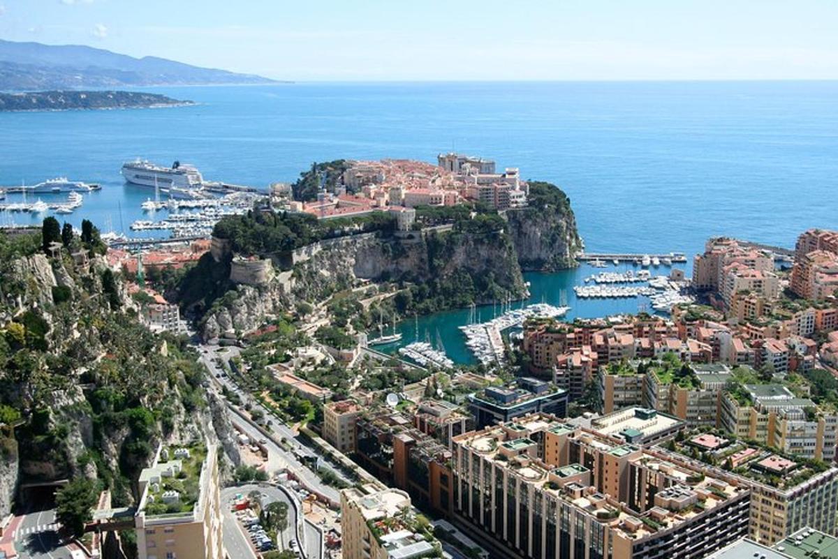 an aerial view of a city with boats in the water