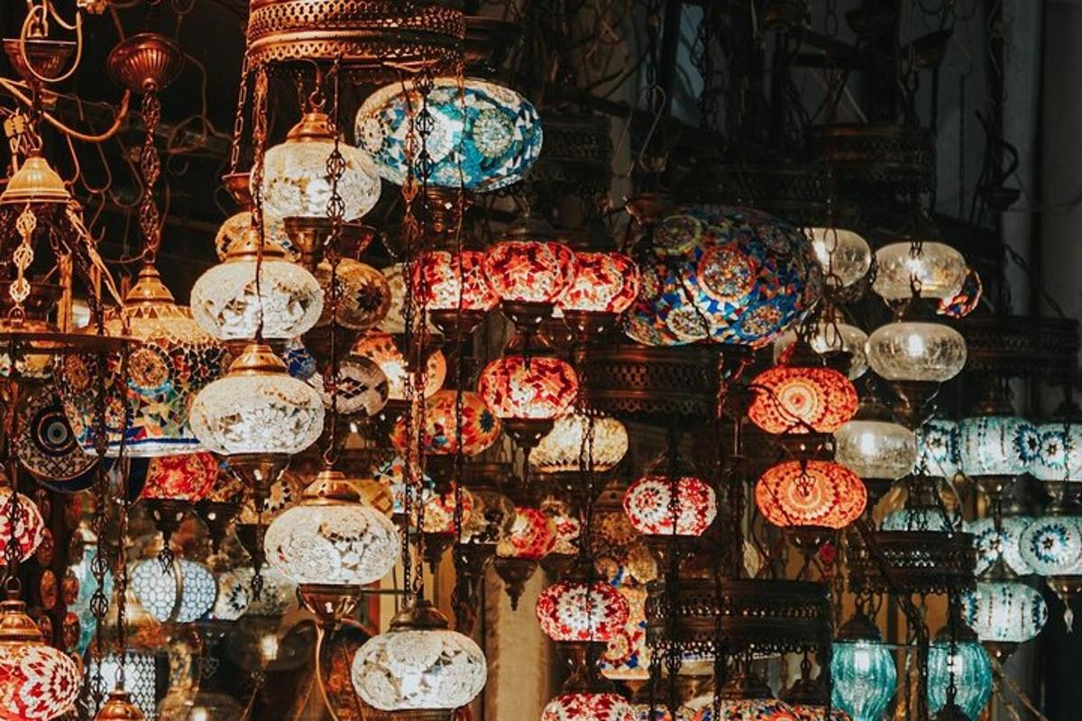 a bunch of colorful lamps hanging in a store