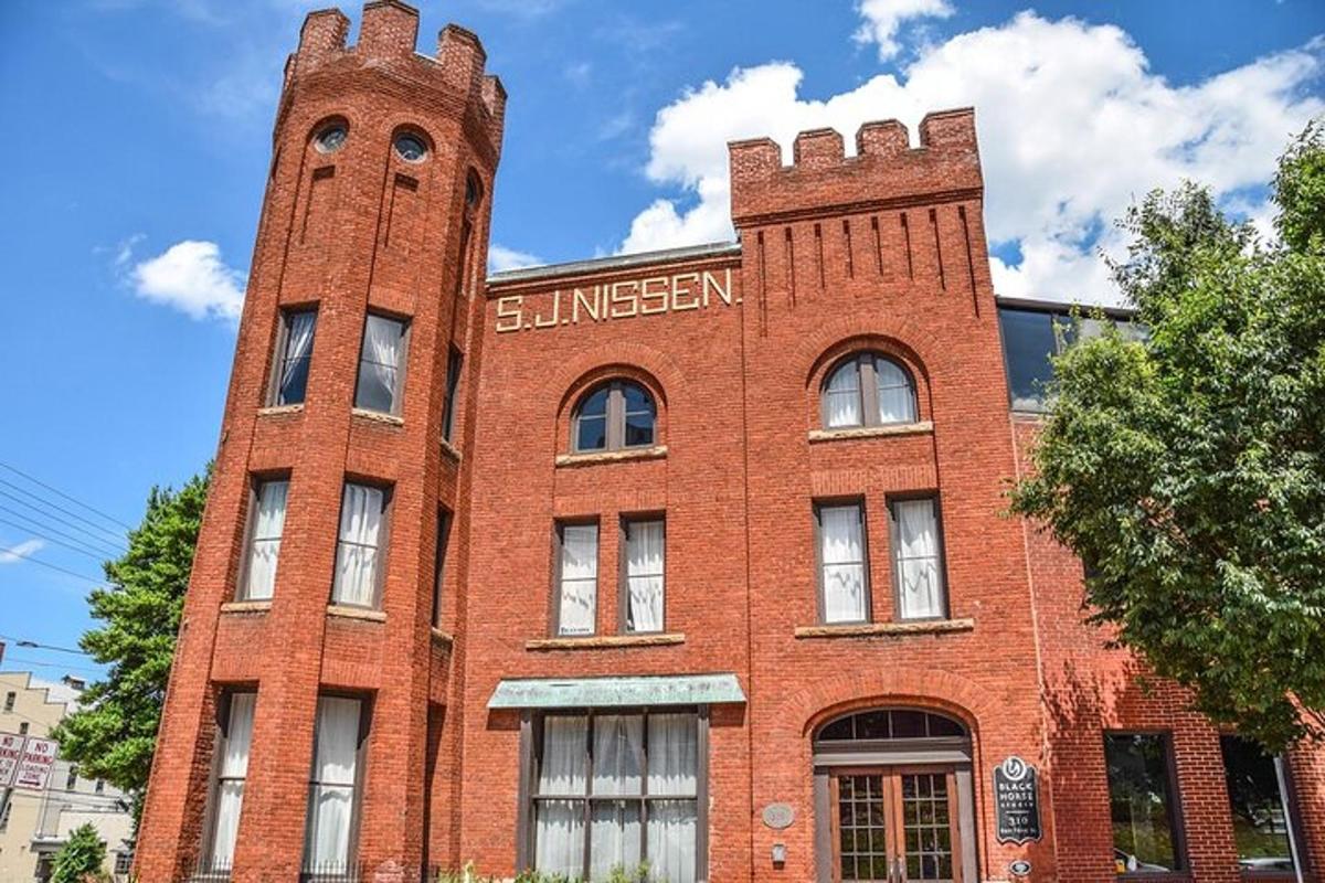 a red brick building with two towers on it