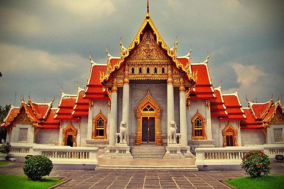 a large building with a red and gold roof