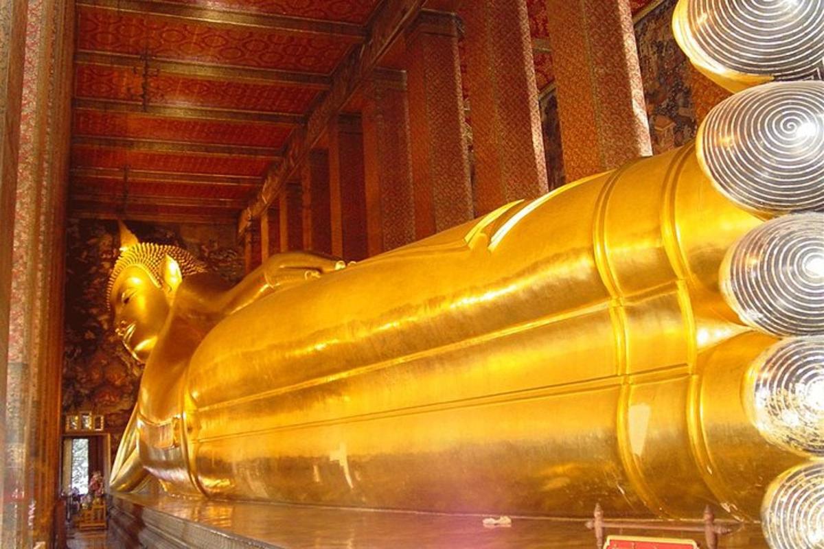 a gold statue of a golden elephant in a room