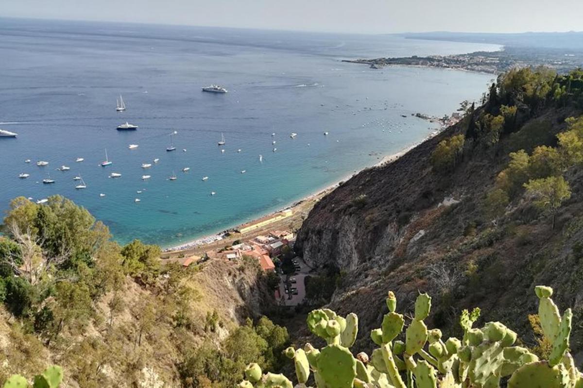 a view of a beach with boats in the water