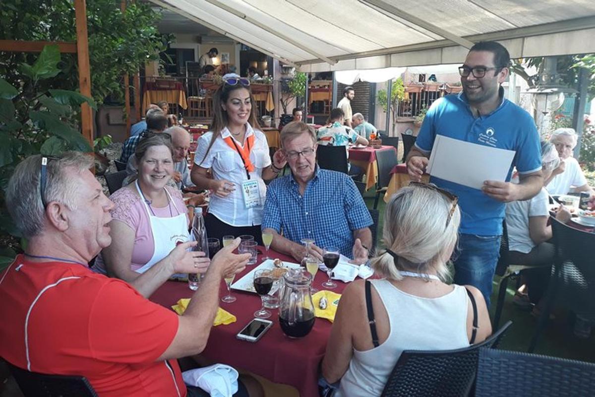 a group of people sitting around a table in a restaurant