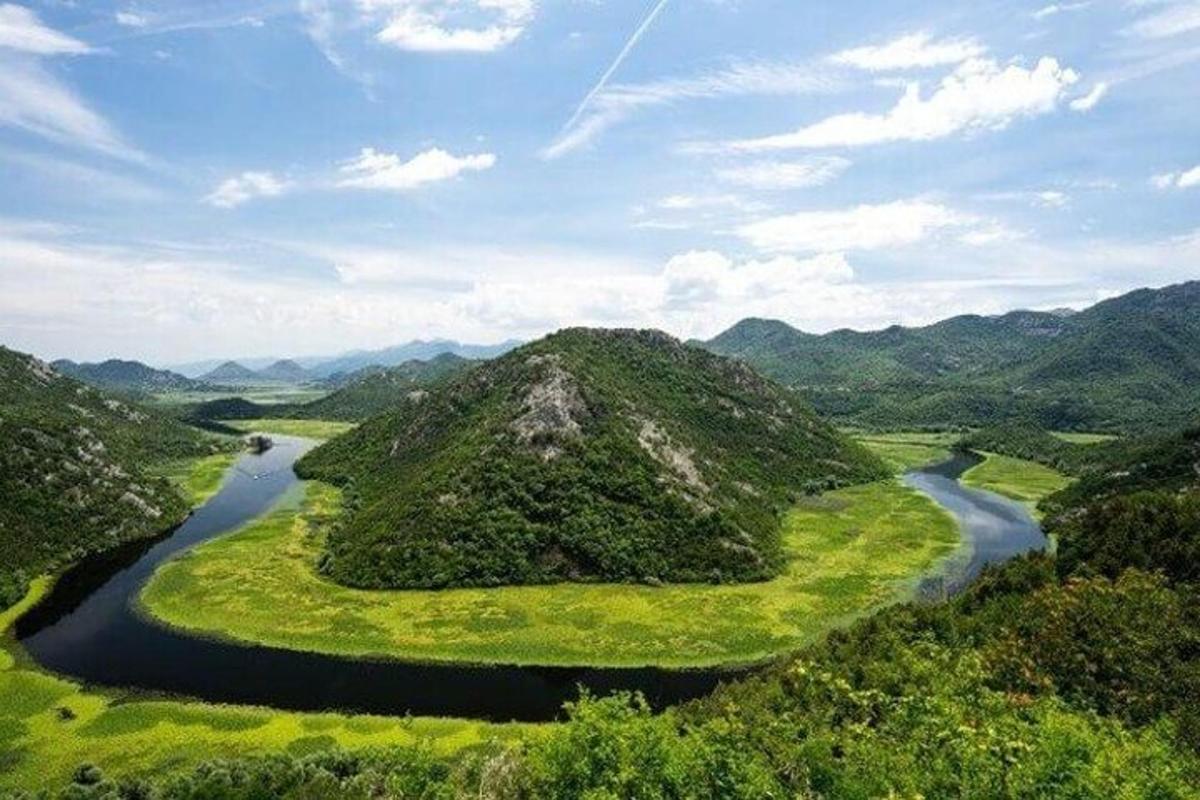 an aerial view of a mountain with a river
