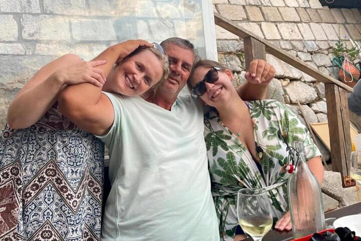 a man and two women posing for a picture