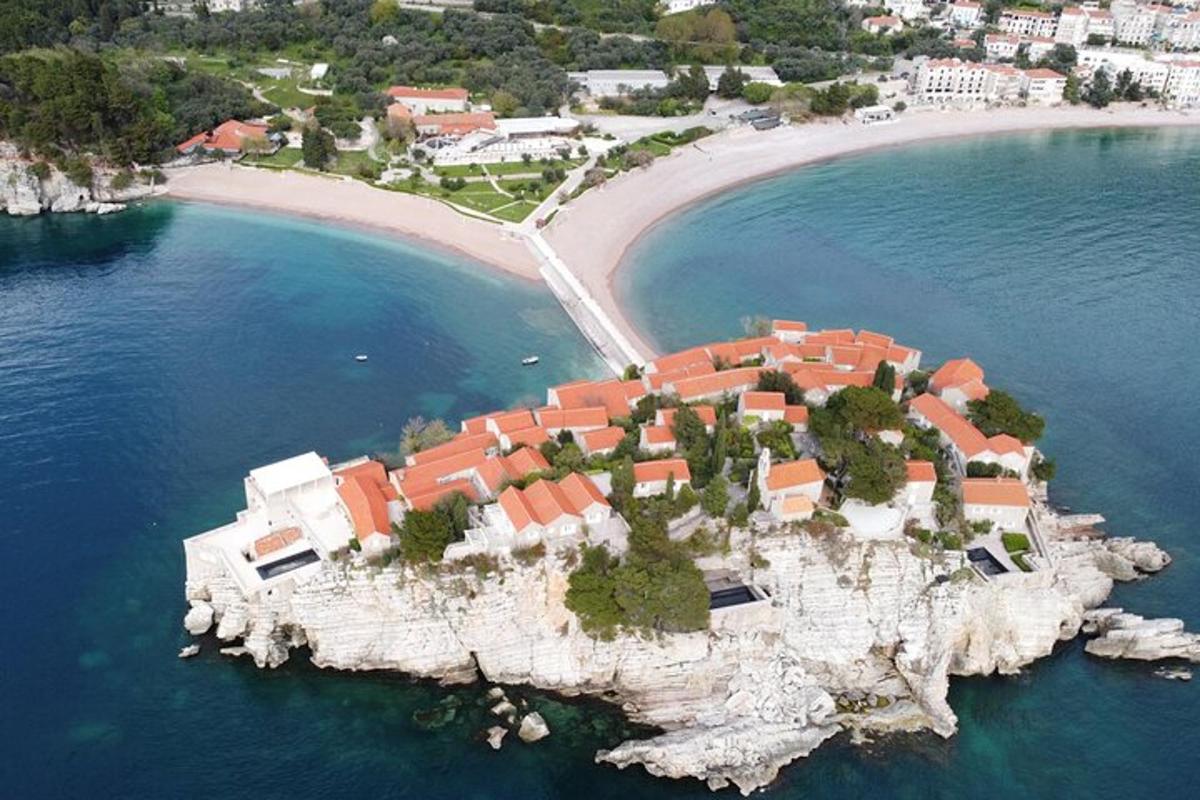 an island in the water with houses on it