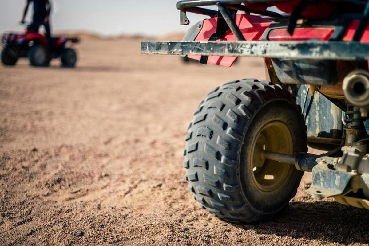 a close up of a wheel in the desert