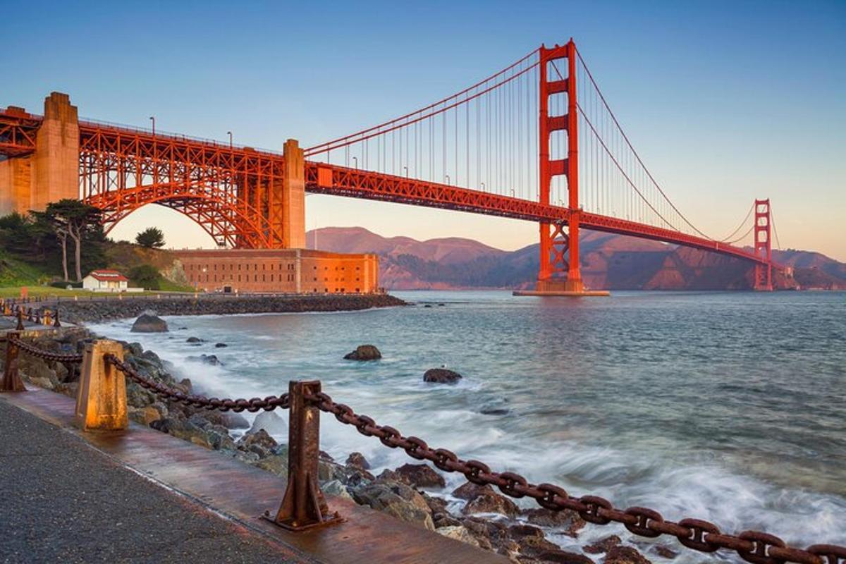 a golden gate bridge over the water in front