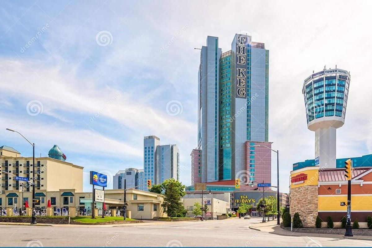 a city skyline with tall buildings and a tower