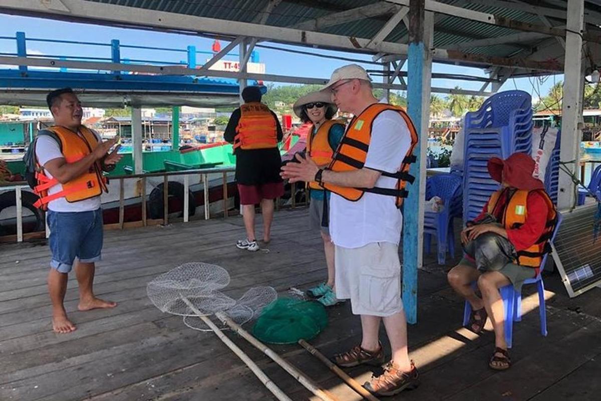 a group of people wearing life vests on a boat
