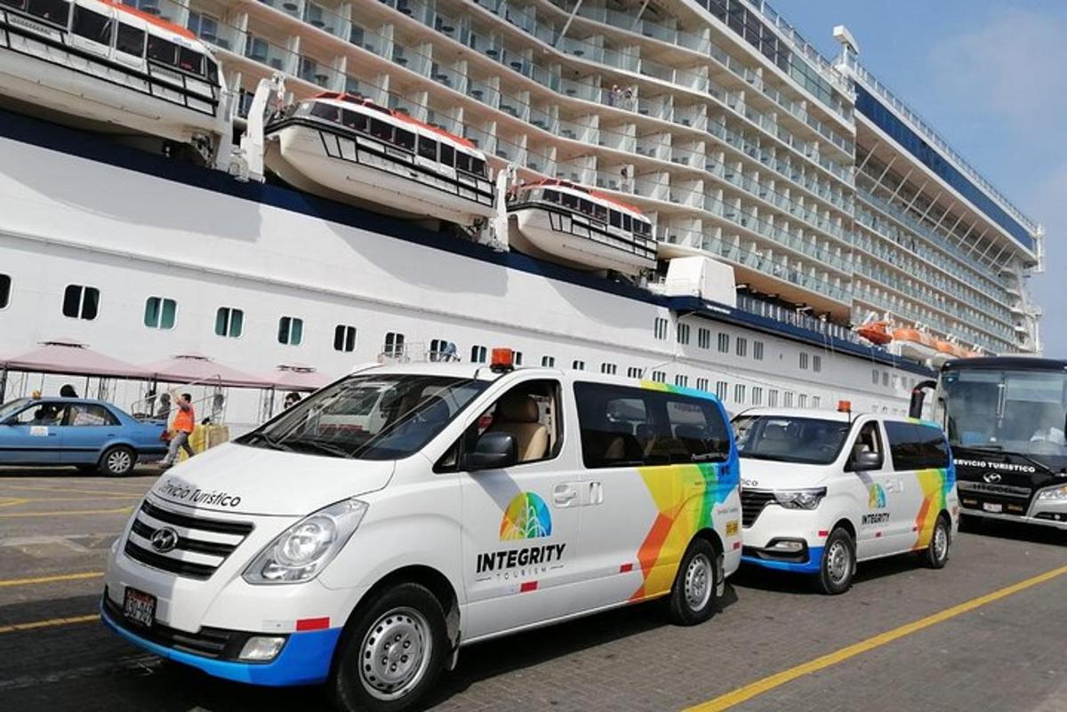 three vans parked in front of a cruise ship