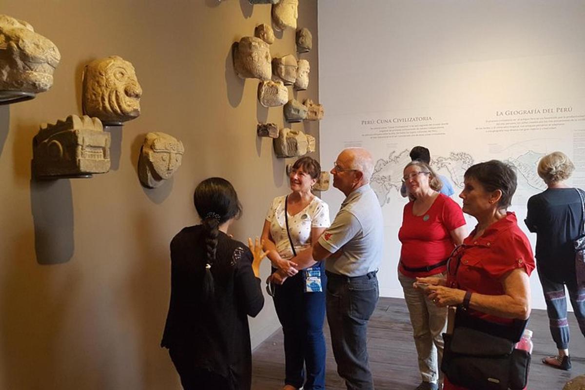 a group of people standing in front of a museum exhibit