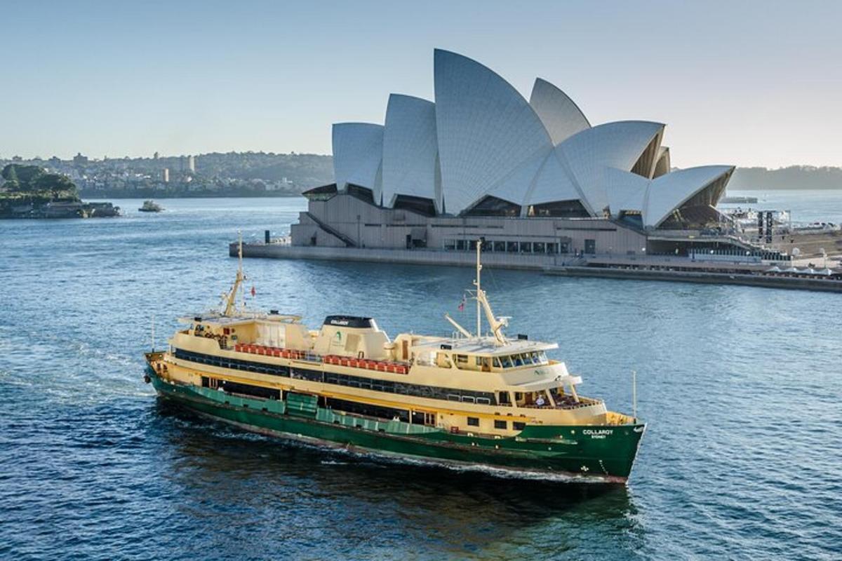 a cruise ship in the water in front of a building