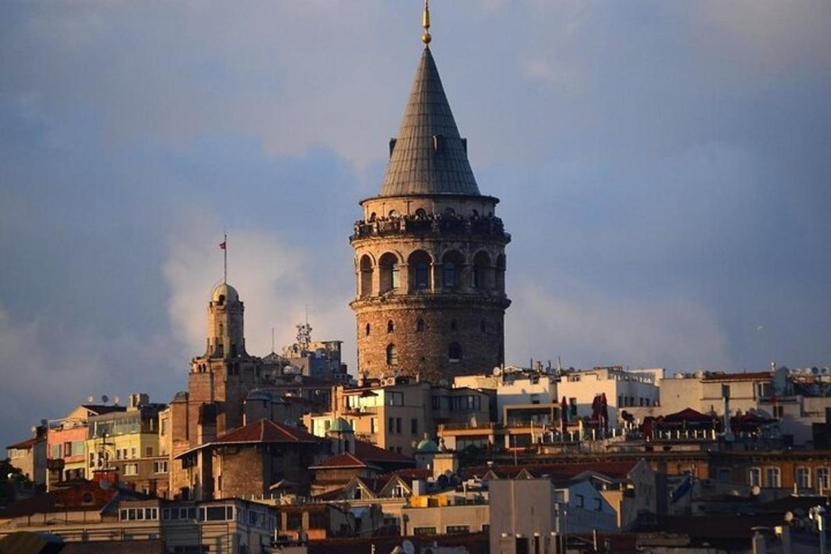 a tall building with a steeple on top of a city