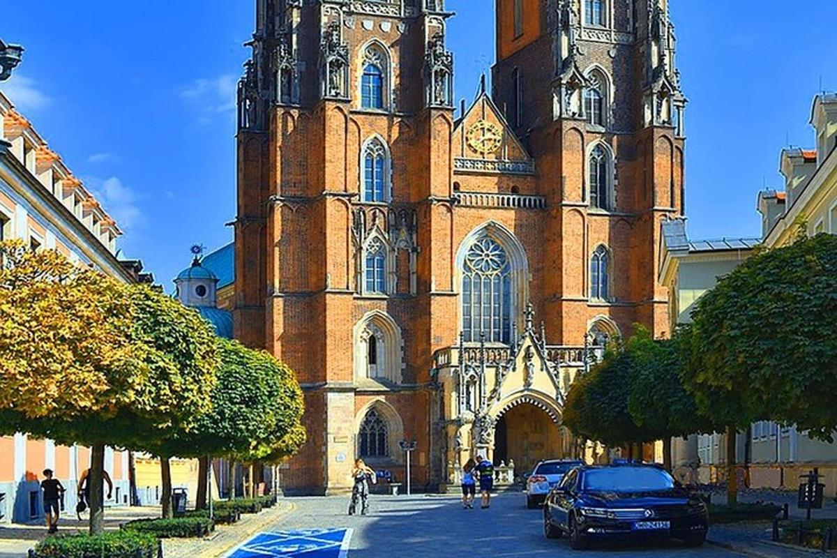 a large church with a clock tower on a street