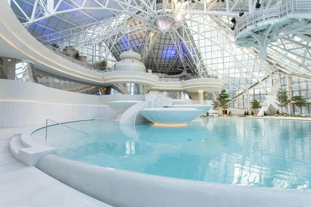 a swimming pool in a building with a water slide