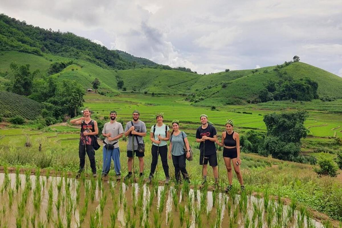 a group of people standing in a field