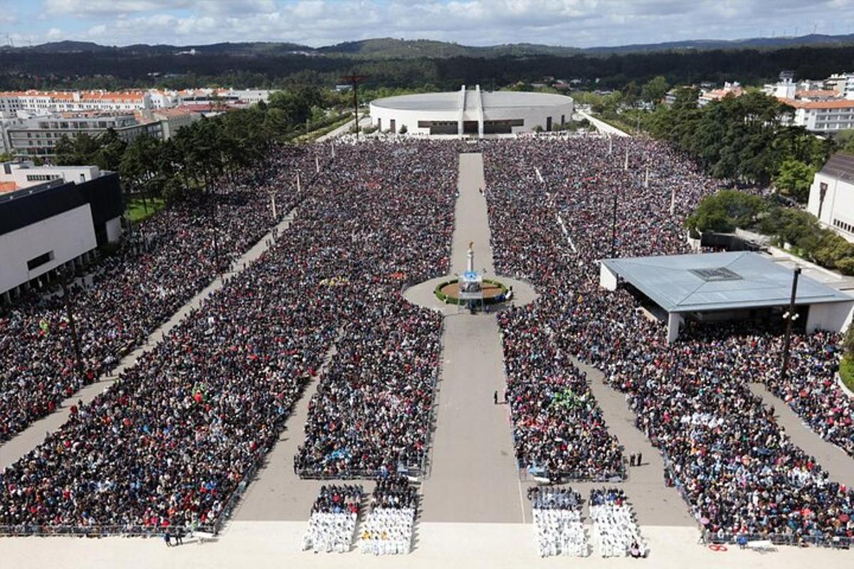 a large crowd of people are gathered at a concert