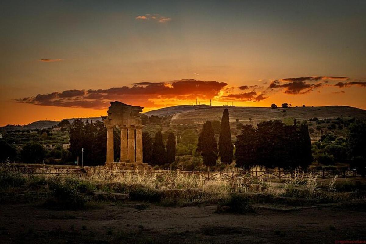 an ancientropolis with a sunset in the background