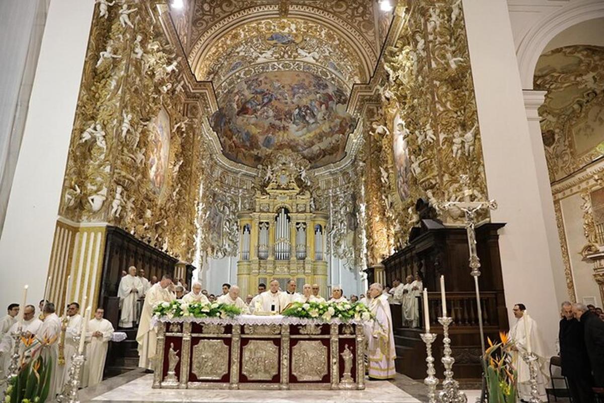 a group of priests standing in a church