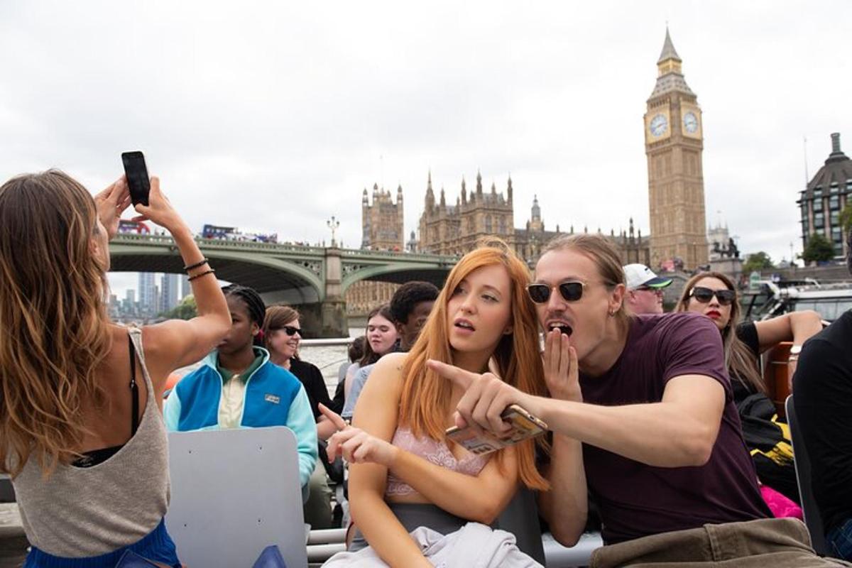 a group of people sitting in front of big ben
