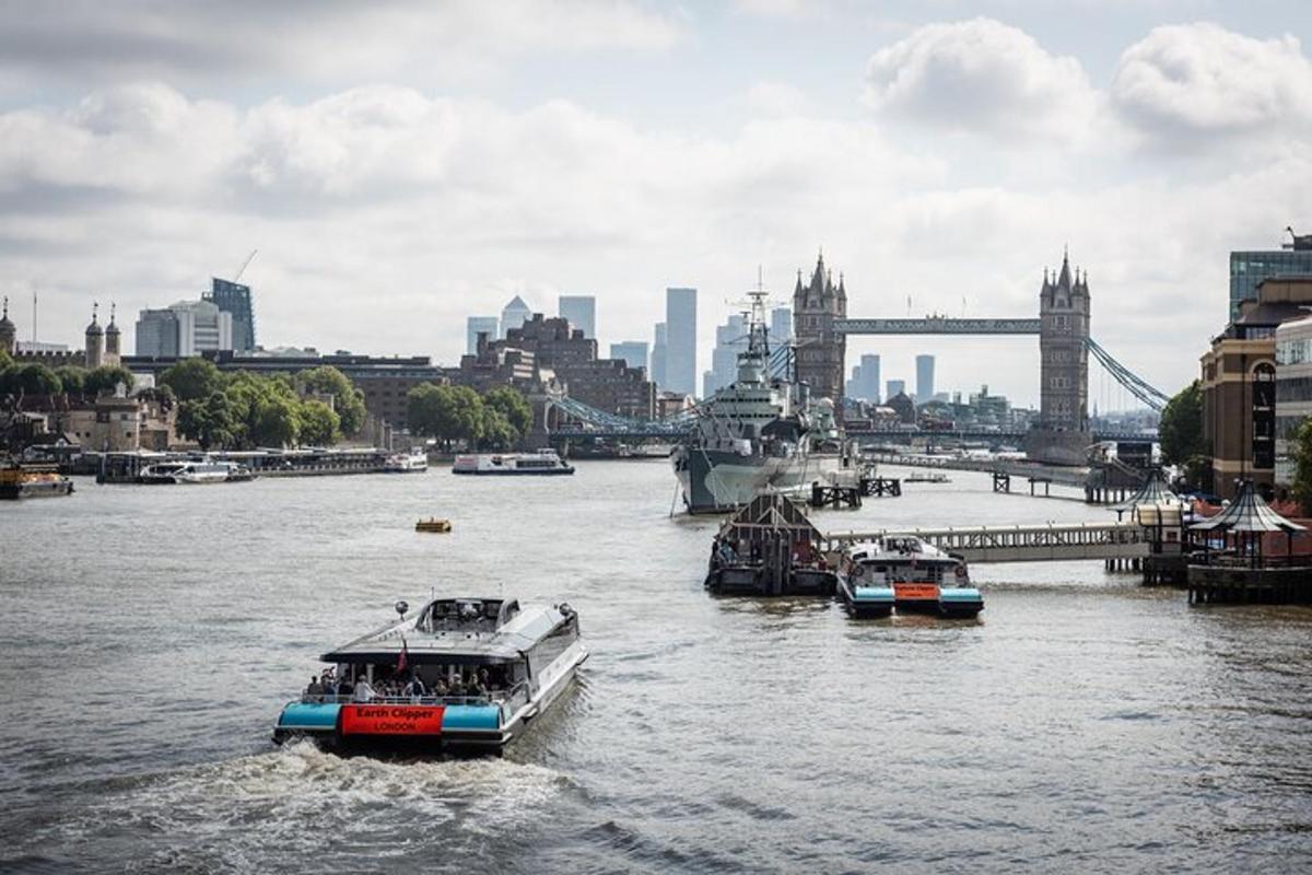 two boats in a river with a city in the background