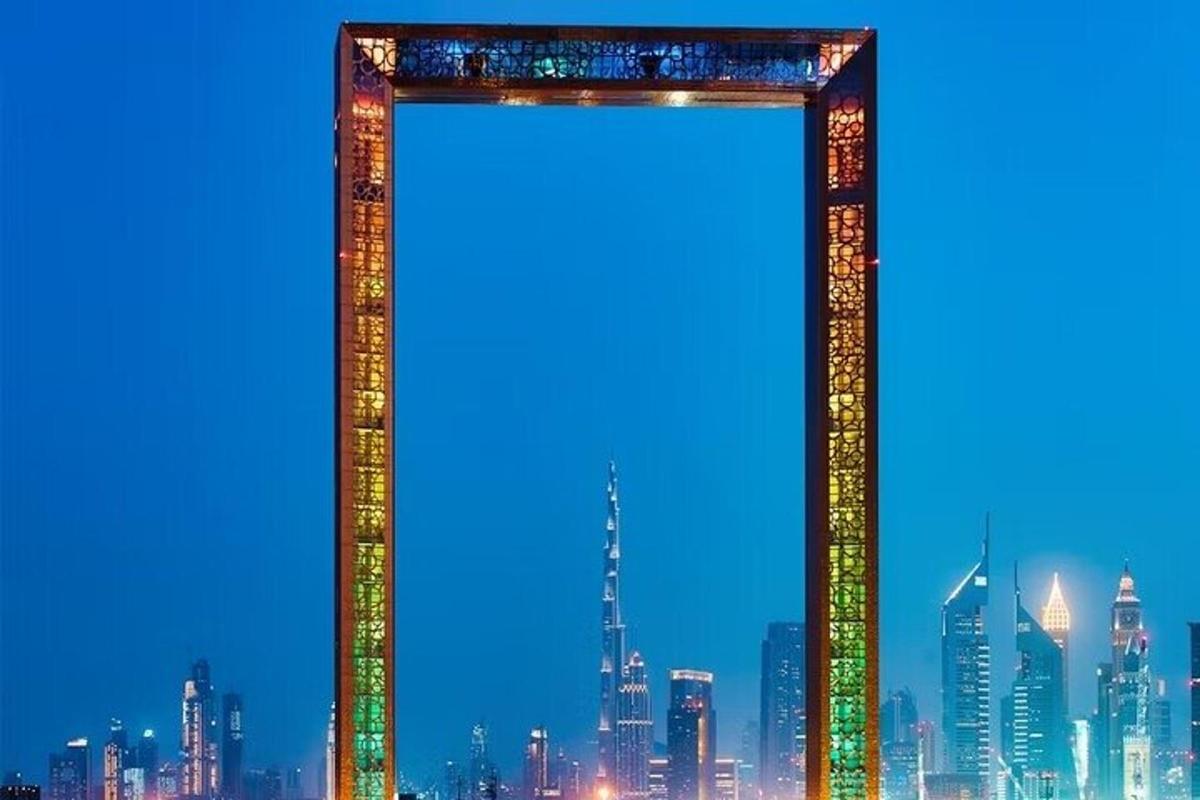 a tall building with a city in the background