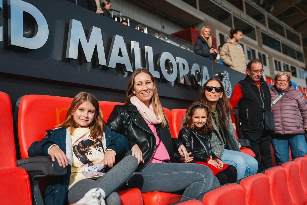 a group of people sitting in seats at a game