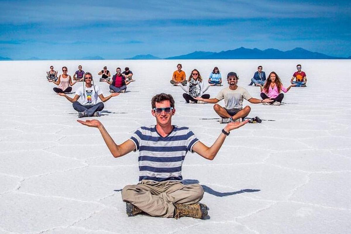 a group of people sitting in the desert
